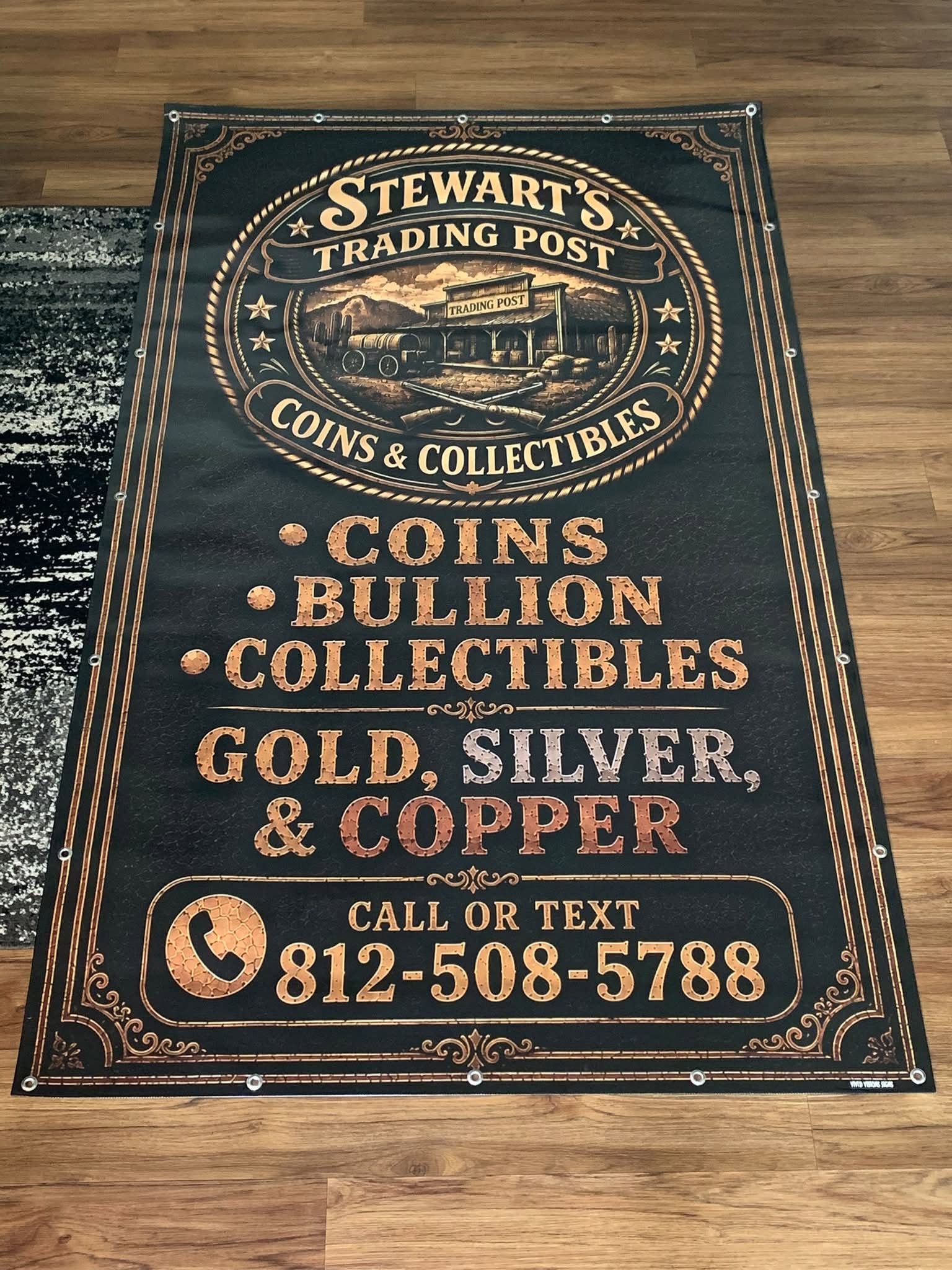 Stewart's Trading Post custom banner in copper and gold on black, listing coins, bullion, and collectibles