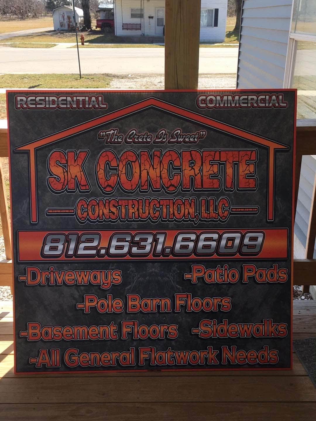 SK Concrete Construction LLC sign listing driveways, patio pads, pole barn floors, basement floors, and sidewalks