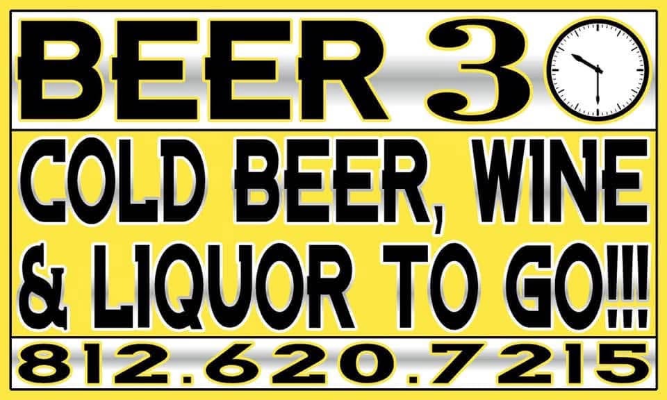 Beer 30 business sign reading Cold Beer, Wine and Liquor To Go with a clock face